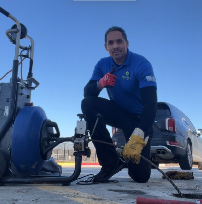 Full Force Plumbing drain cleaning equipment in use